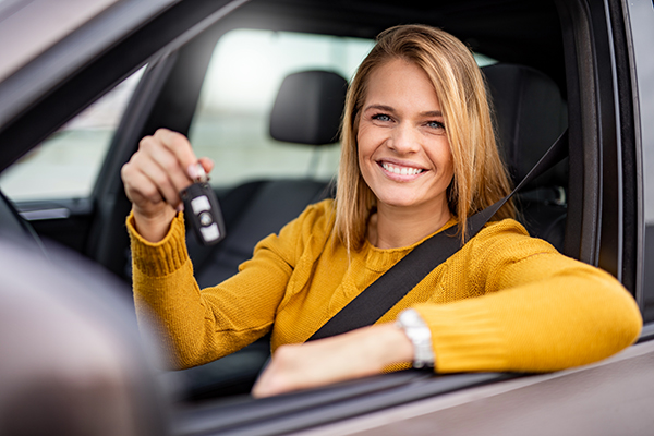 woman sitting in new car